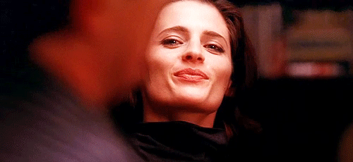 Stana Katic nodding in a satisfied manner GIF