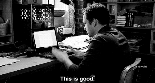 Writer pleased with his computer gif