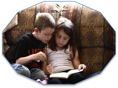 Image of boy and girl reading together.