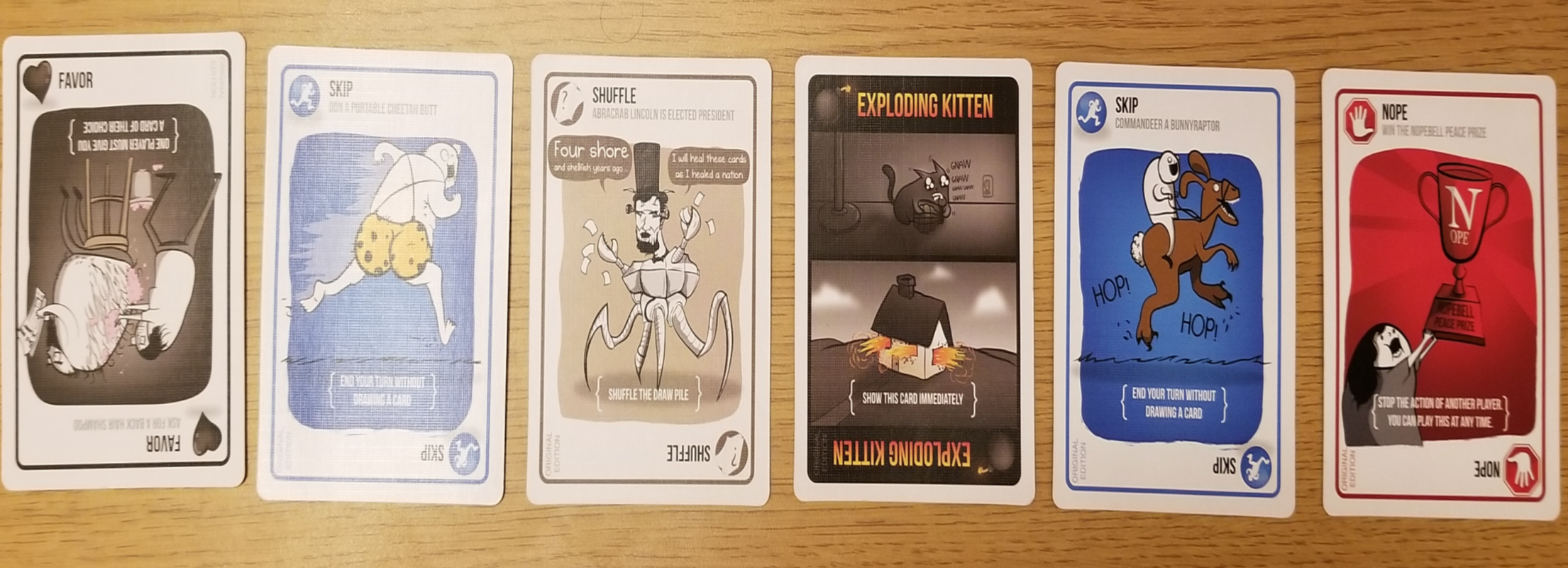 three lines of cards showing how Exploding Kittens cards look originally, filtered through red color blindness, and blue color blindness