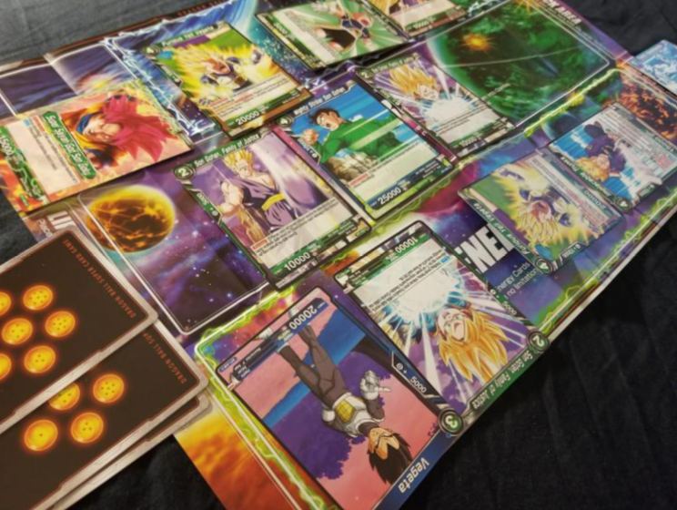 cards from the Dragonball Z card game arranged on a table