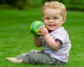 boy toddler plays with ball