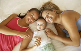 lgbtq family pictured in bed