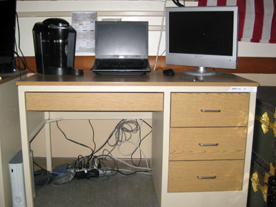 A cadet desk in the barracks, with computer.